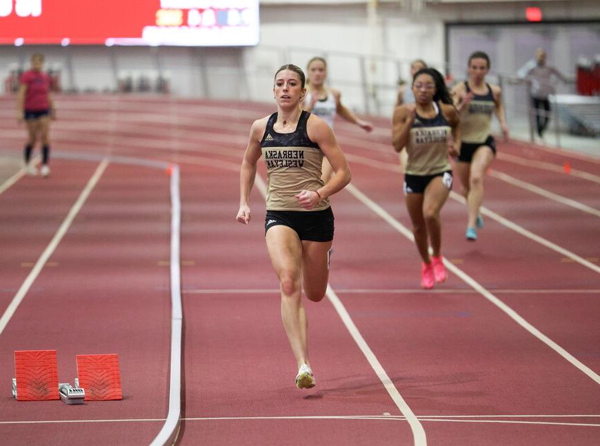 Bella Hogue runs on a track. 